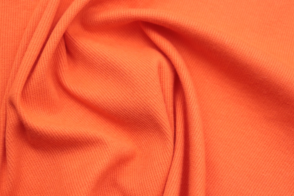 a close up view of an orange fabric