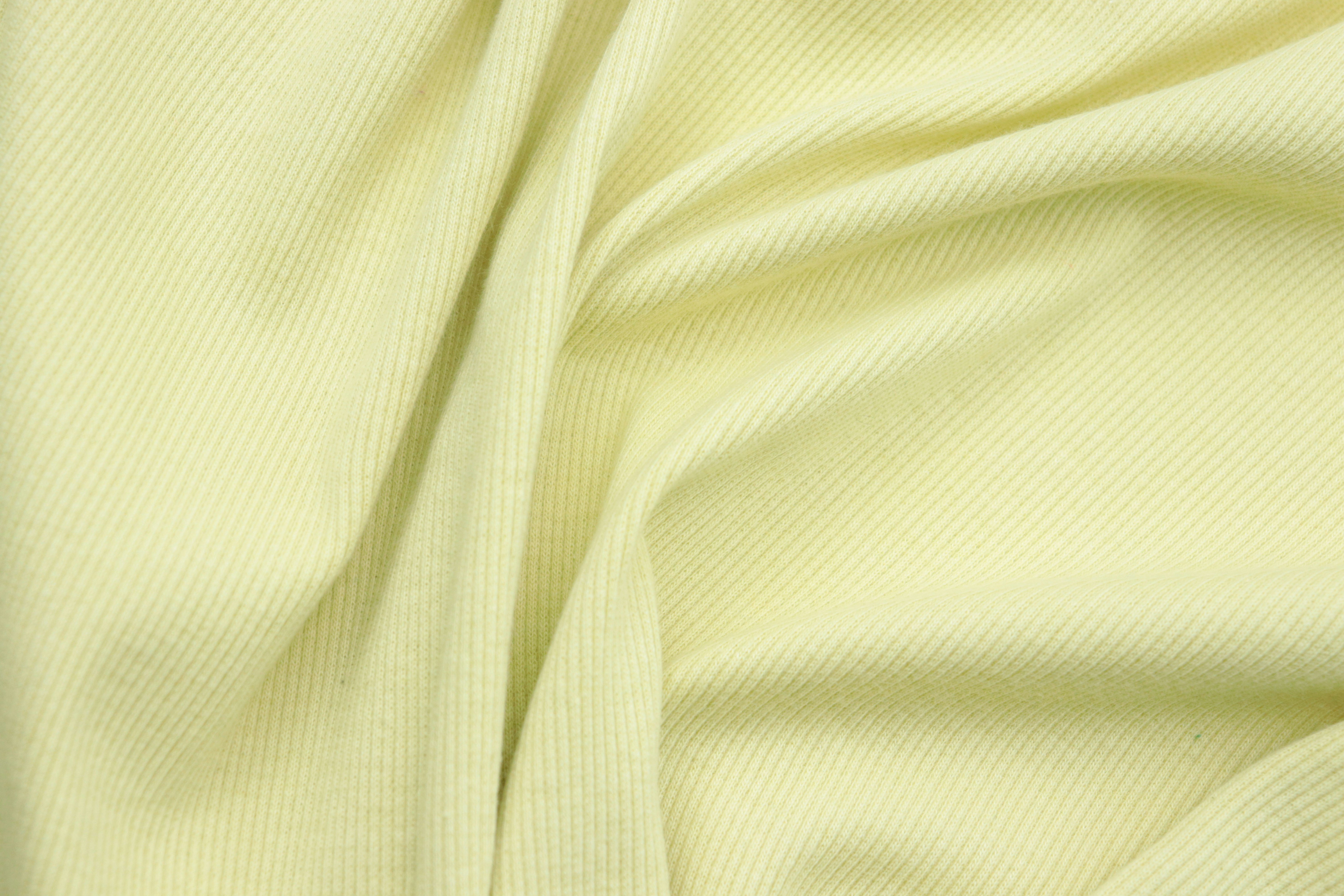 a close up view of a yellow fabric