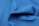 Close-up of a premium blue frost t-shirt showing detailed fabric texture and crisp custom print.