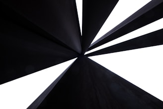 Abstract art showing converging pathways leading to a single bright center.