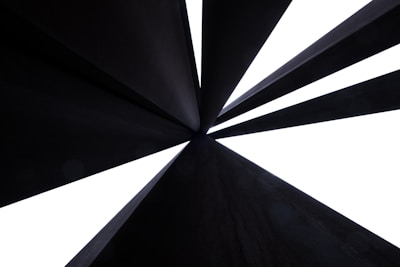 Abstract art showing converging pathways leading to a single bright center.