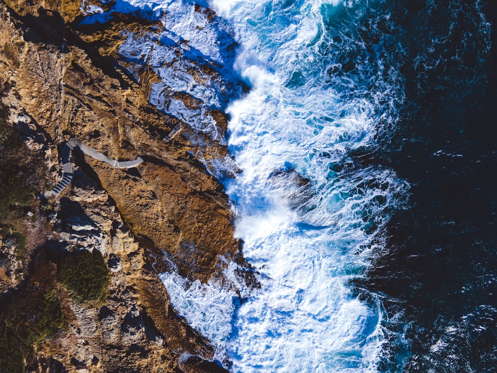 a bird's eye view of the ocean and cliffs