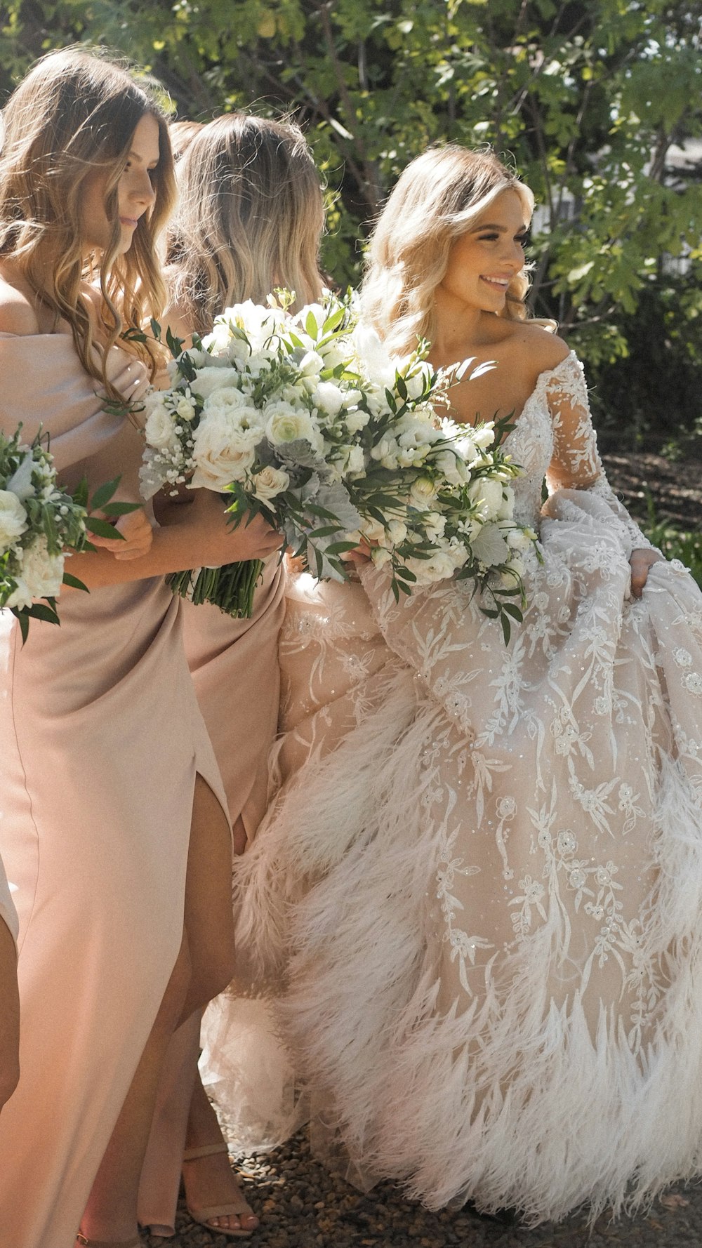 a group of women in long dresses standing next to each other