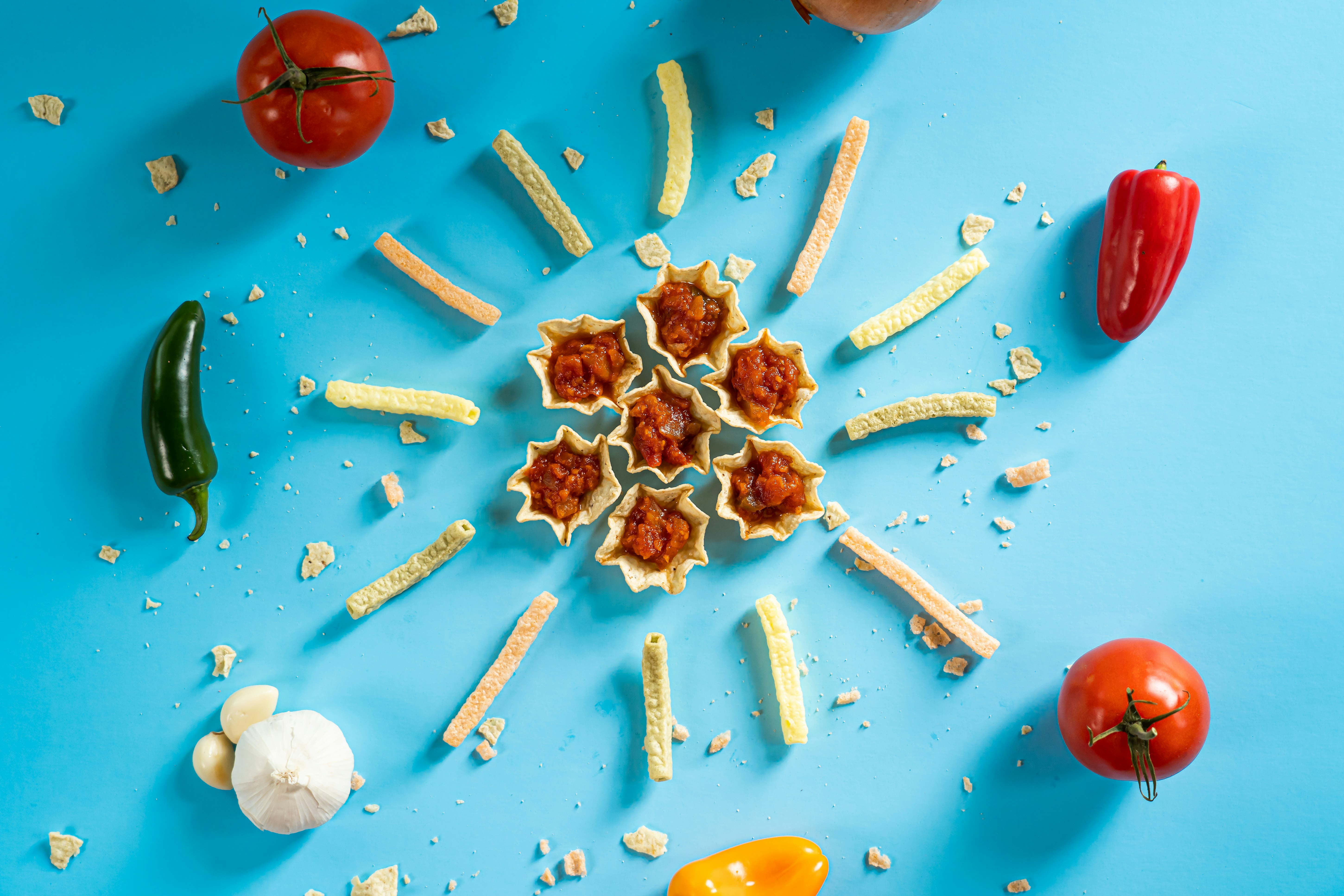 a bunch of food that is on a blue surface