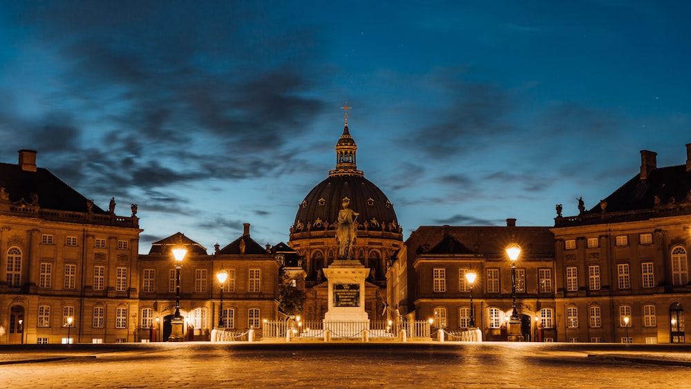 a large building with a fountain in front of it