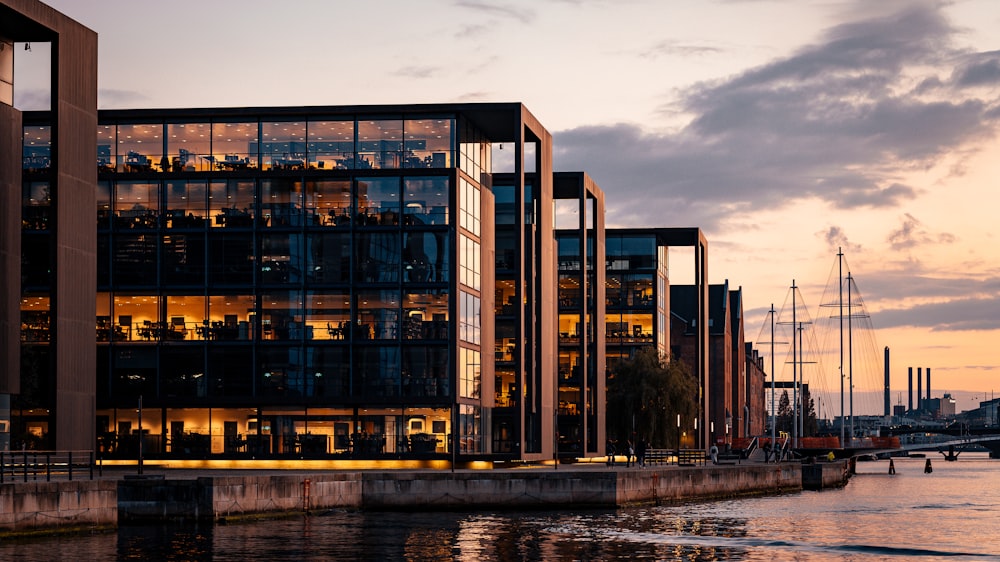 a large building sitting next to a body of water