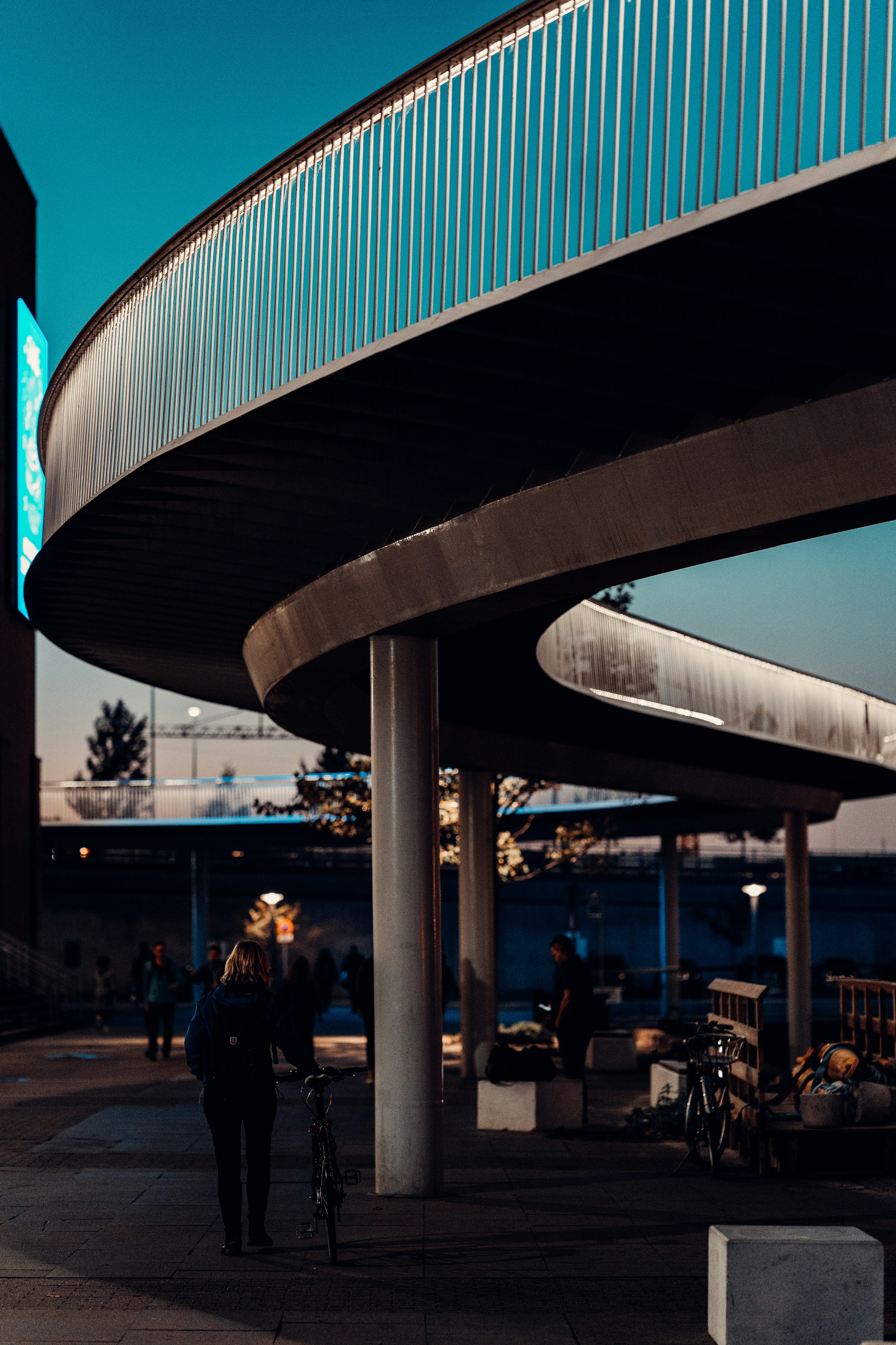 a couple of people that are walking down a sidewalk