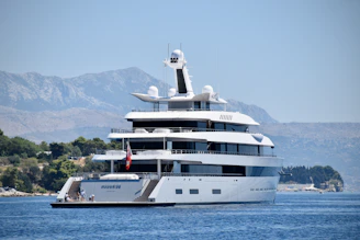 a large white boat floating on top of a body of water