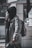 A person comfortably wearing a stylish backpack alternative while walking in an urban setting.
