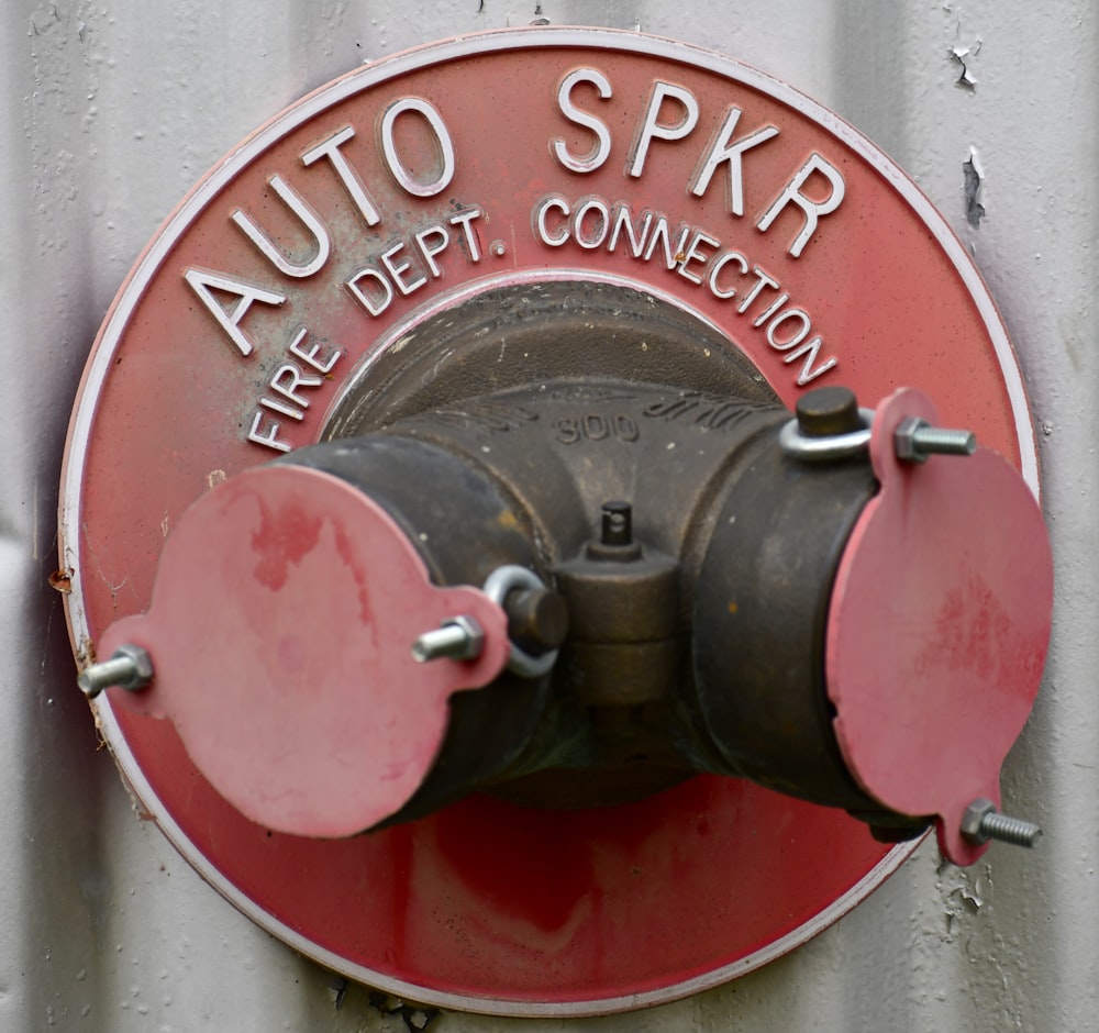 a close up of a red and black fire hydrant