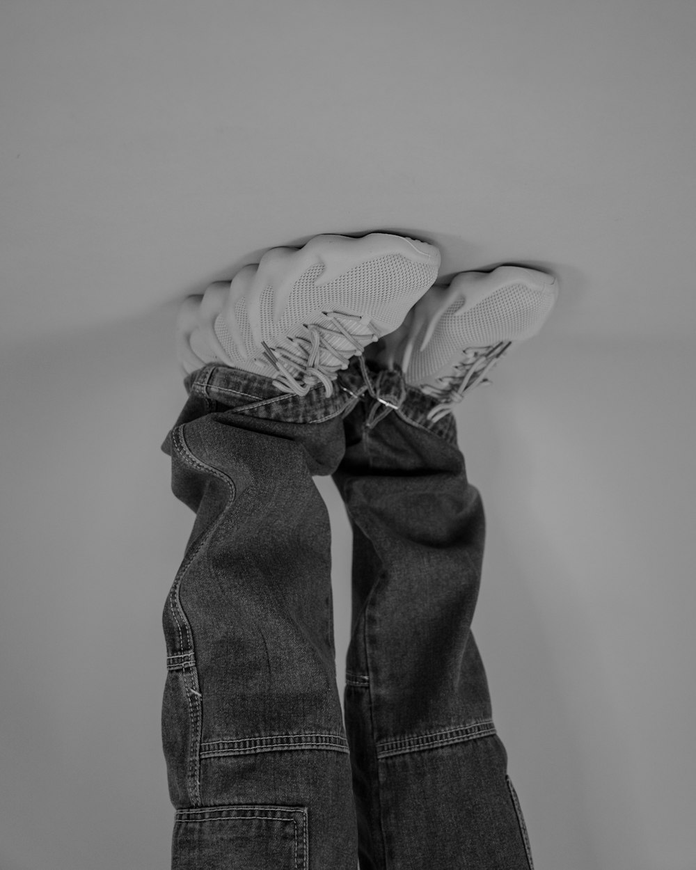 a pair of jeans hanging from the ceiling