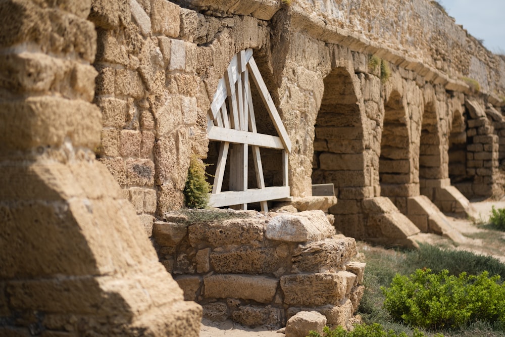 a white chair sitting on top of a stone wall