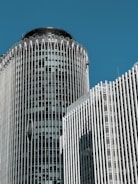 a very tall building with a clock on it's side
