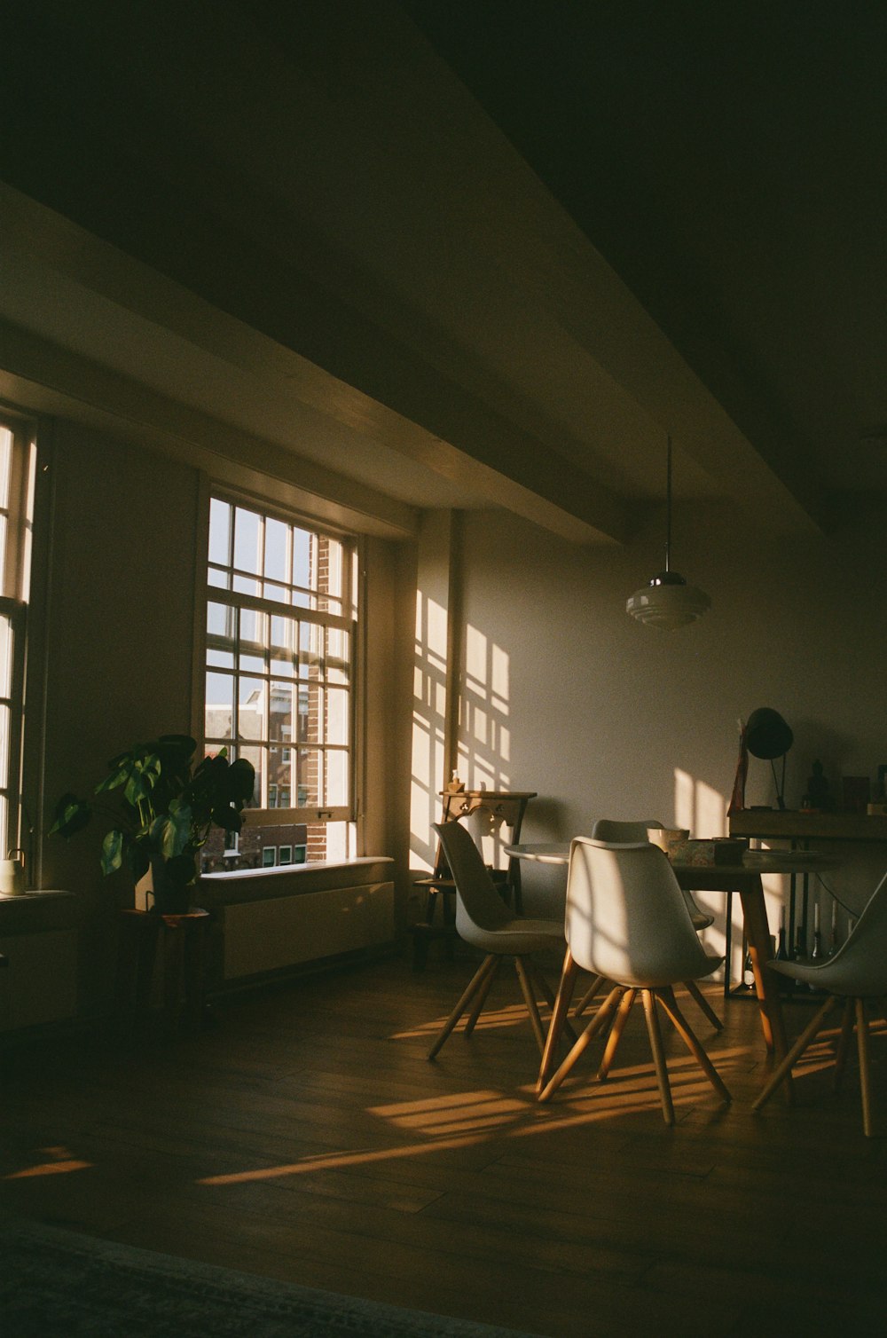 a dining room with a table and chairs in it