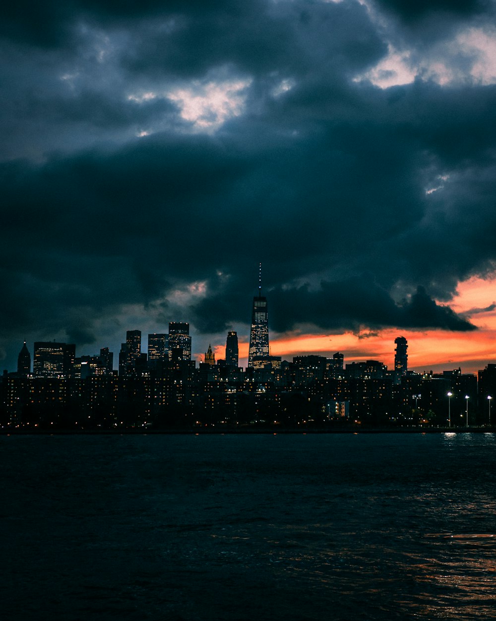 a view of a city at night from the water