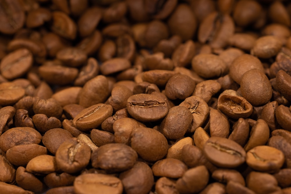 a pile of coffee beans sitting on top of each other