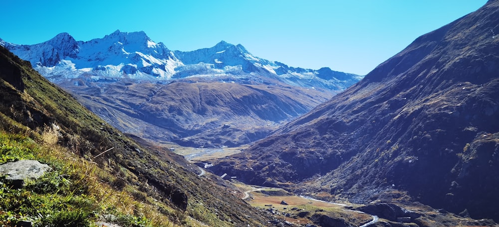 a view of a valley with mountains in the background