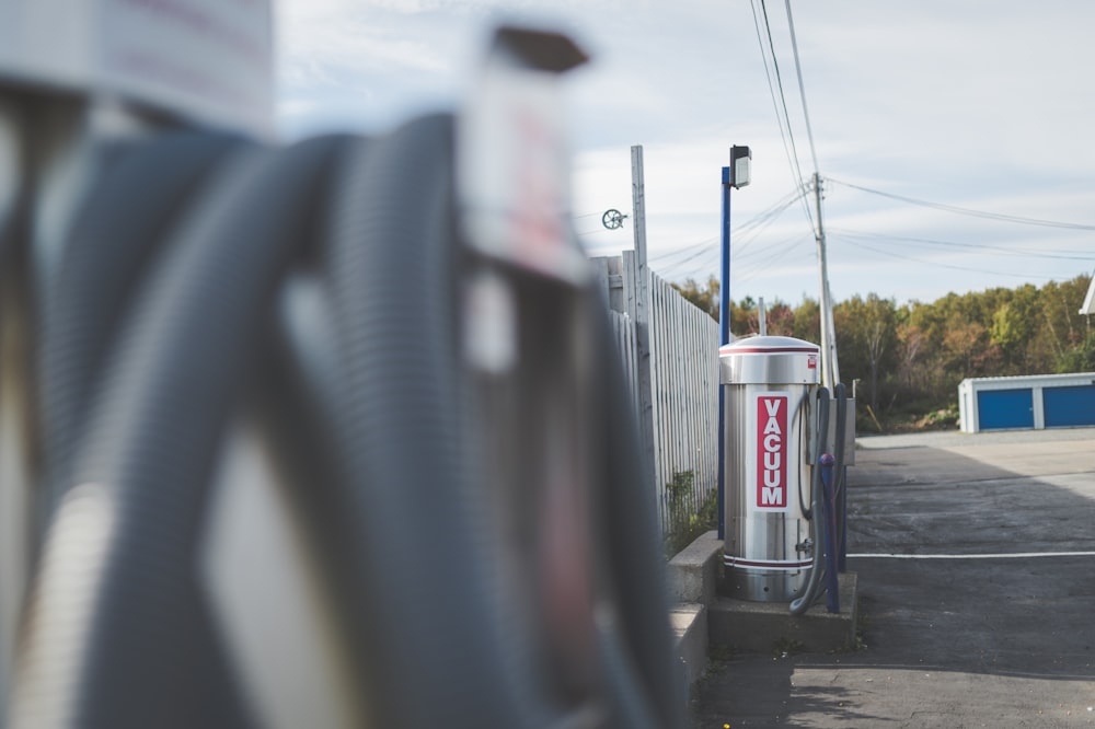 a gas station with a gas pump next to it