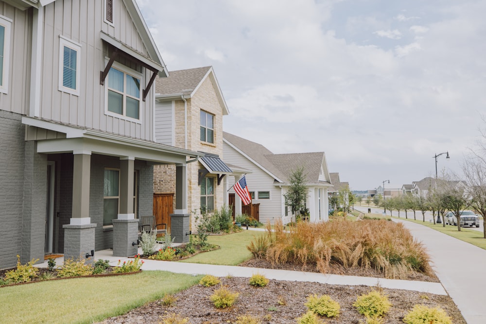 a row of houses with a flag on the front