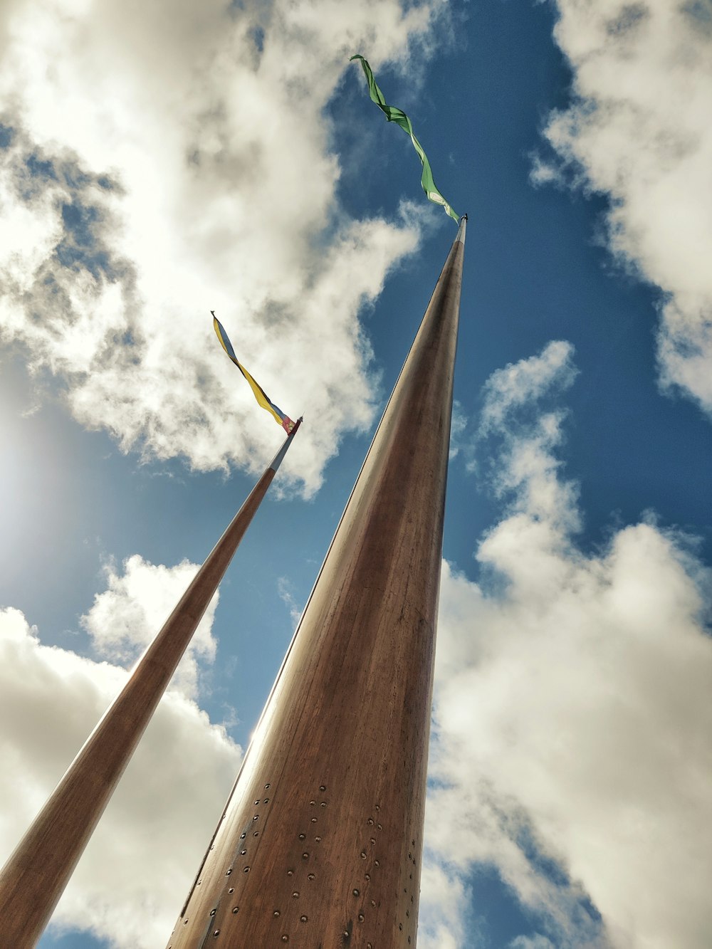 a tall monument with a kite flying in the sky