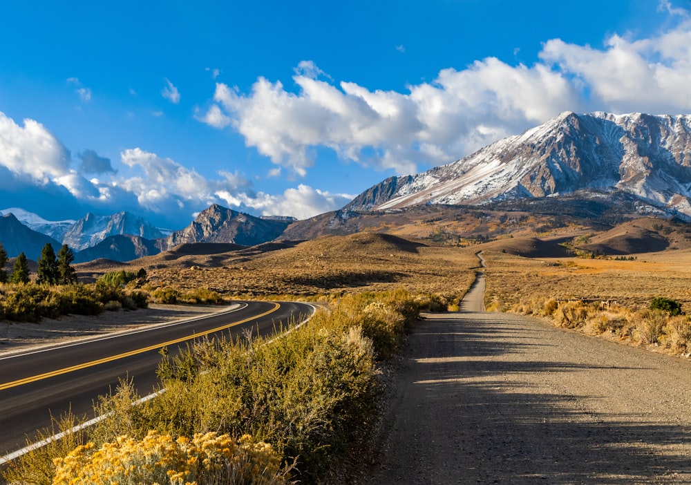 a road with a mountain in the background