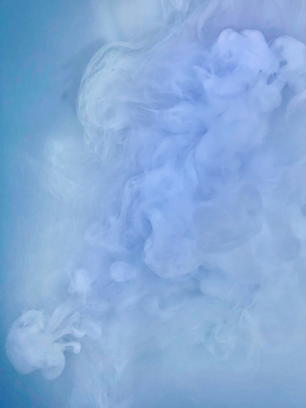 a cloud of smoke floating in the air