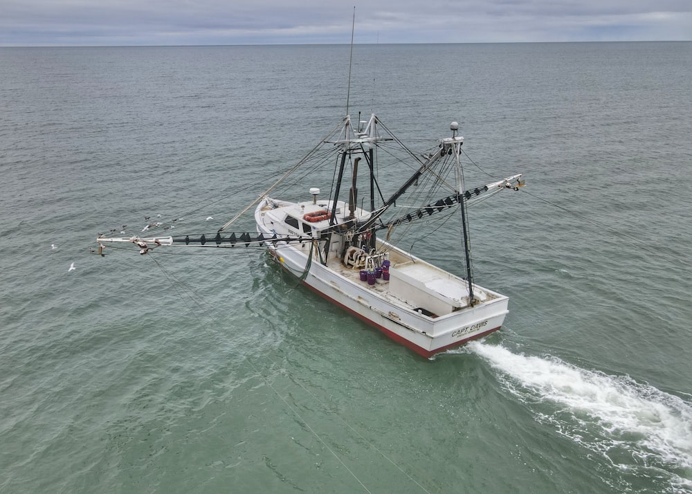 a fishing boat in the middle of the ocean