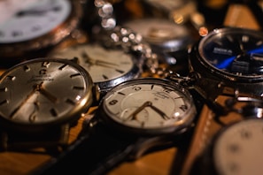 a bunch of watches that are sitting on a table