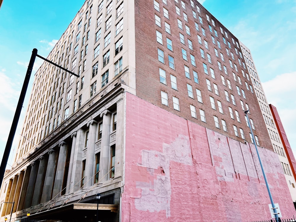 a tall building with a red cross painted on the side of it