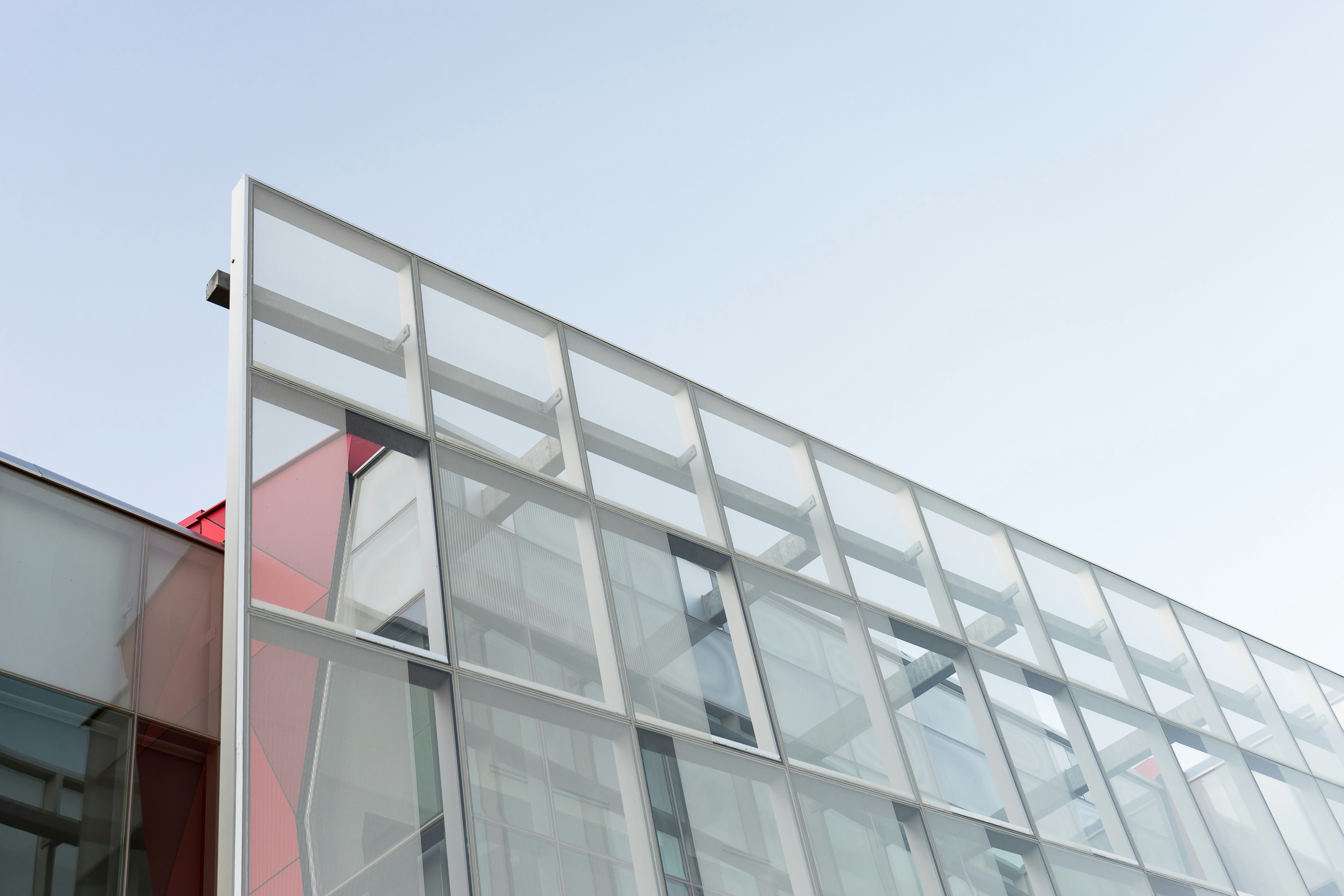 a building with a lot of windows and a sky background
