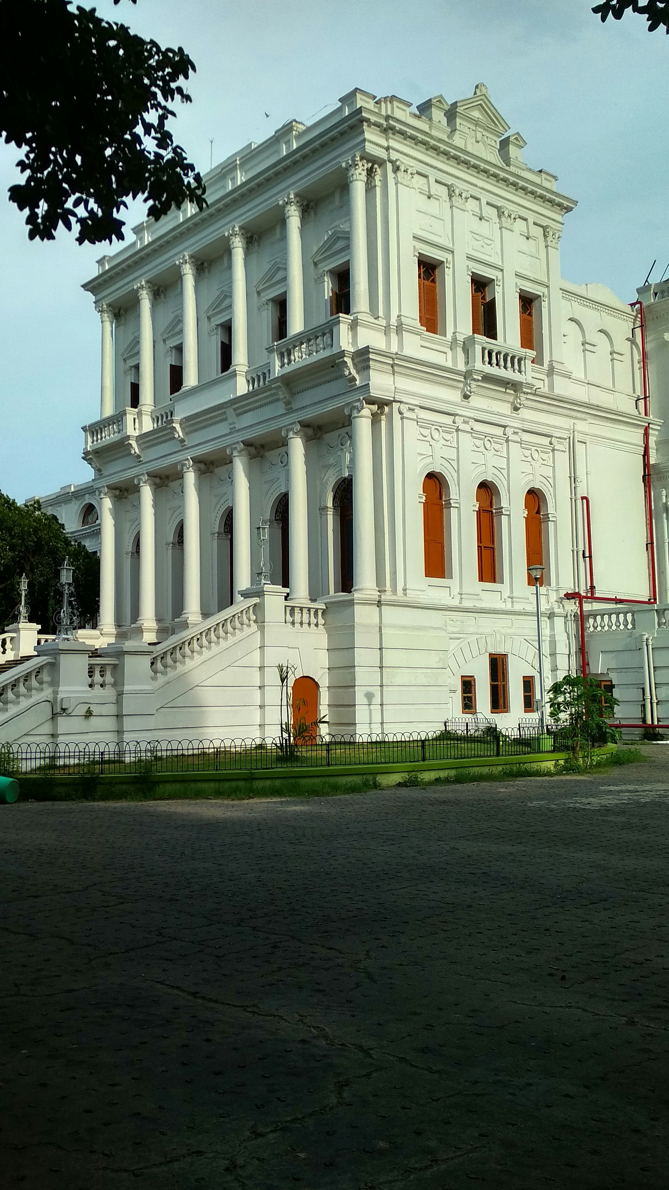 Grand colonial university arts college building with ornate arches and wide staircase