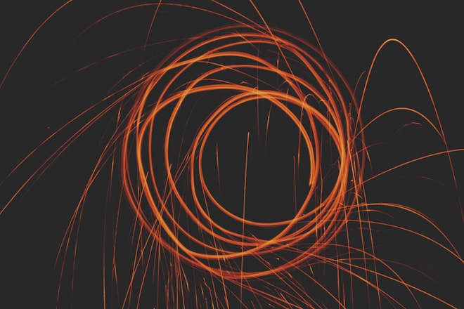 an orange spiral is shown against a black background