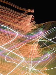 a blurry photo of a clock tower at night