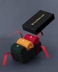 a black box with four pairs of socks in it