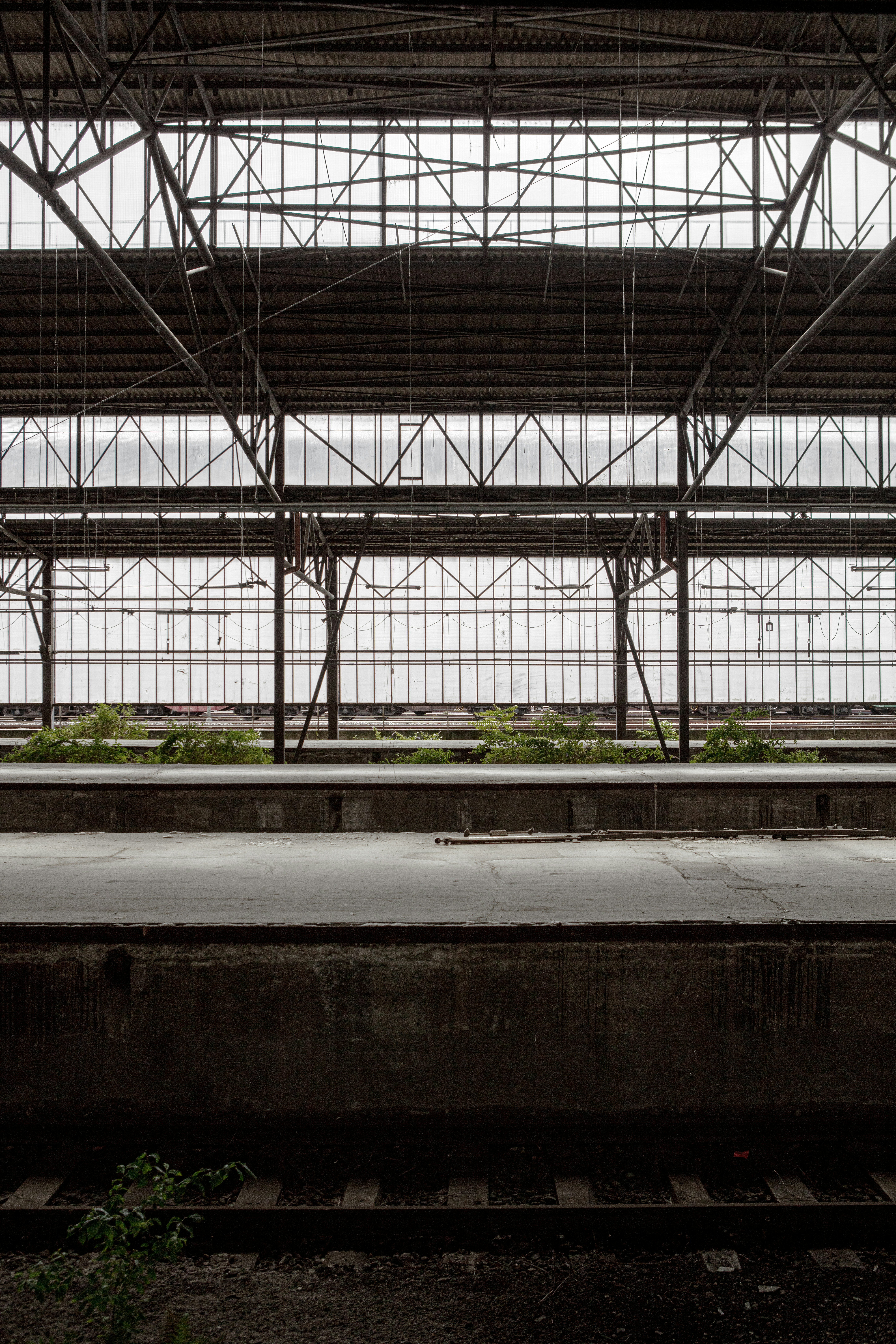a train station with a train on the tracks