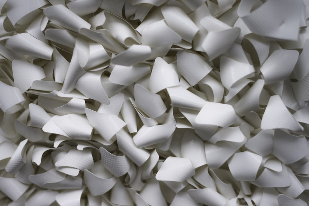 a close up of a pile of white objects