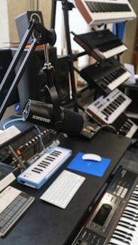 a recording studio with a microphone and keyboard