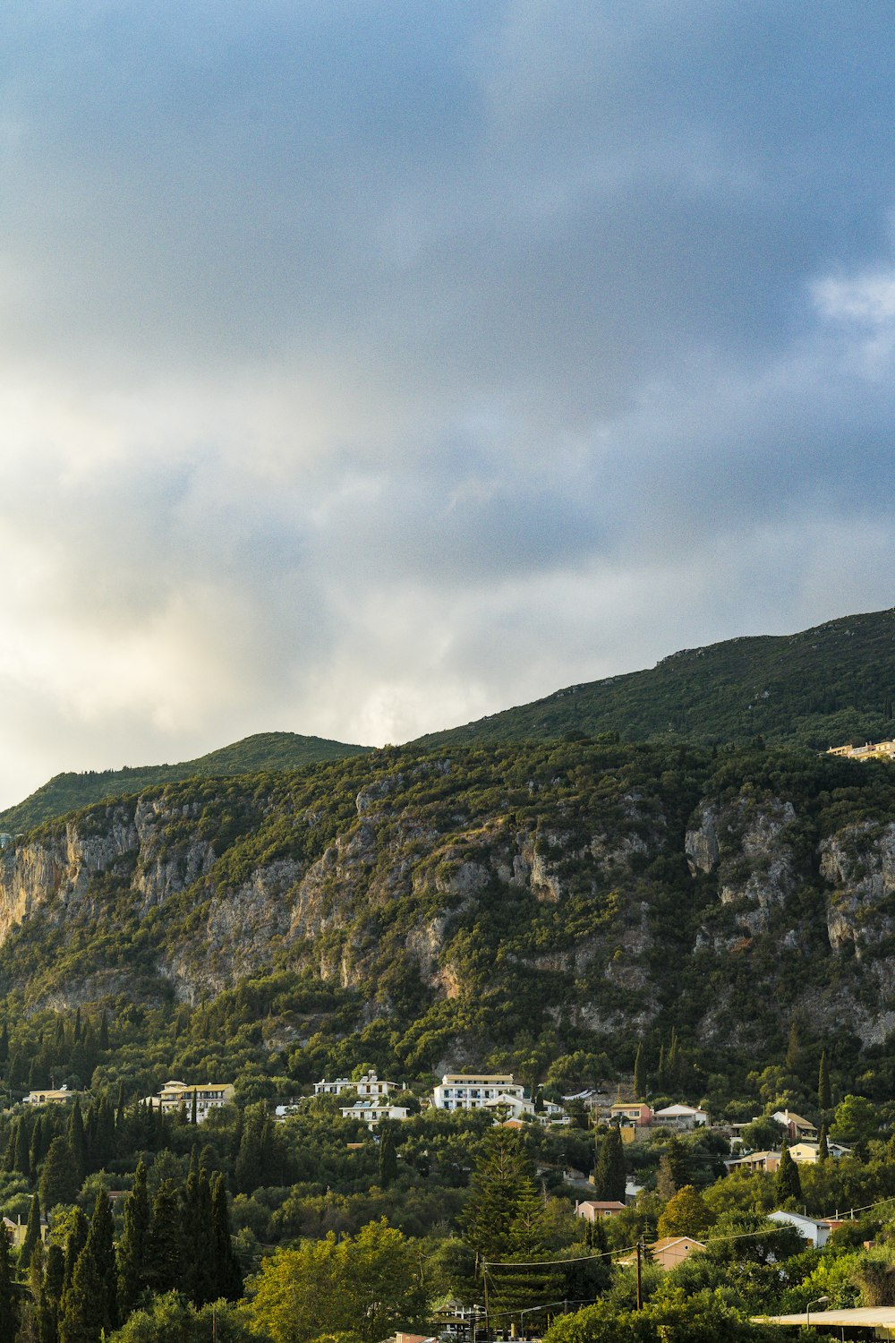 a large hill with houses on the side of it