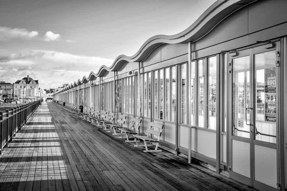 a row of benches sitting next to each other on a wooden floor