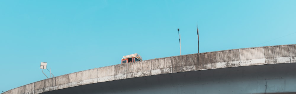 a couple of traffic lights on top of a bridge