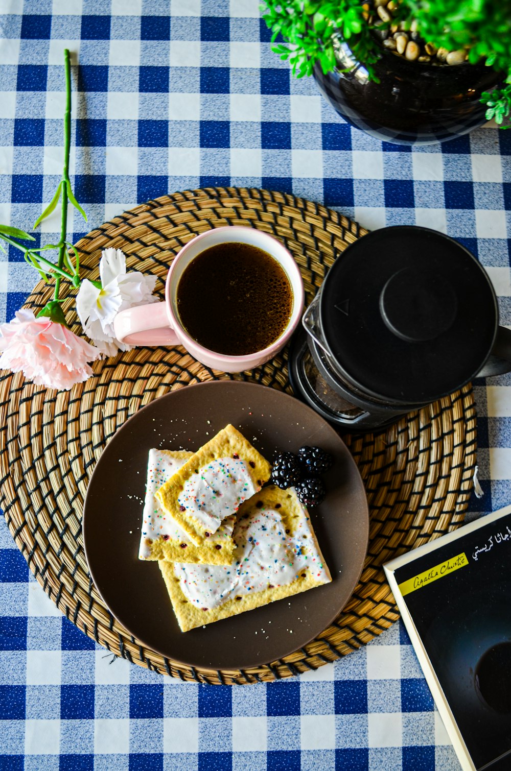 a plate of food and a cup of coffee on a table