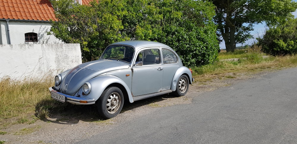 a silver car parked on the side of a road