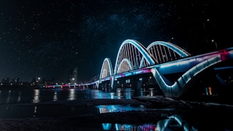 a bridge that is lit up at night