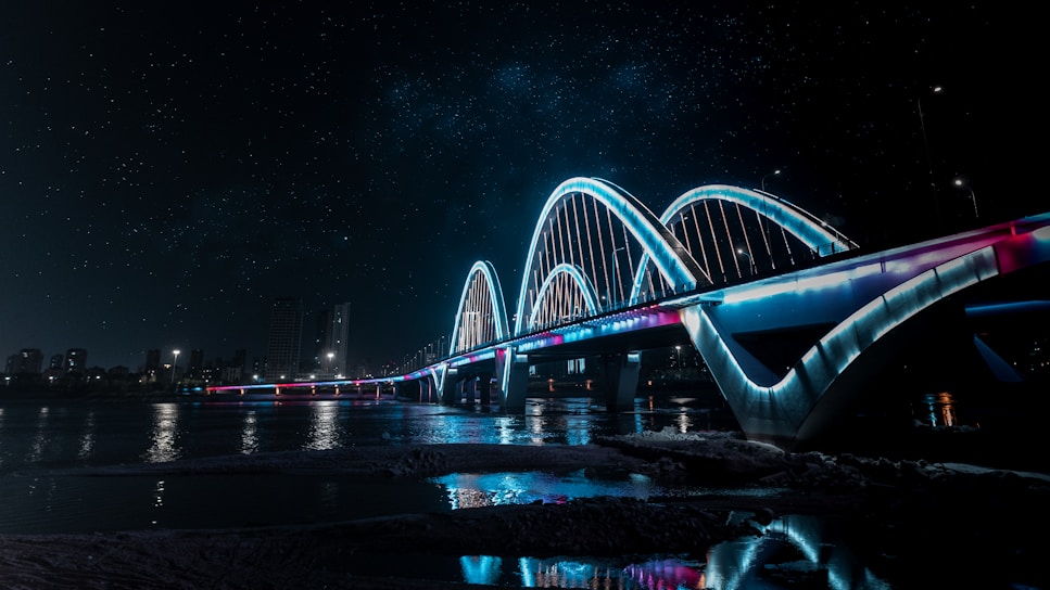 a bridge that is lit up at night