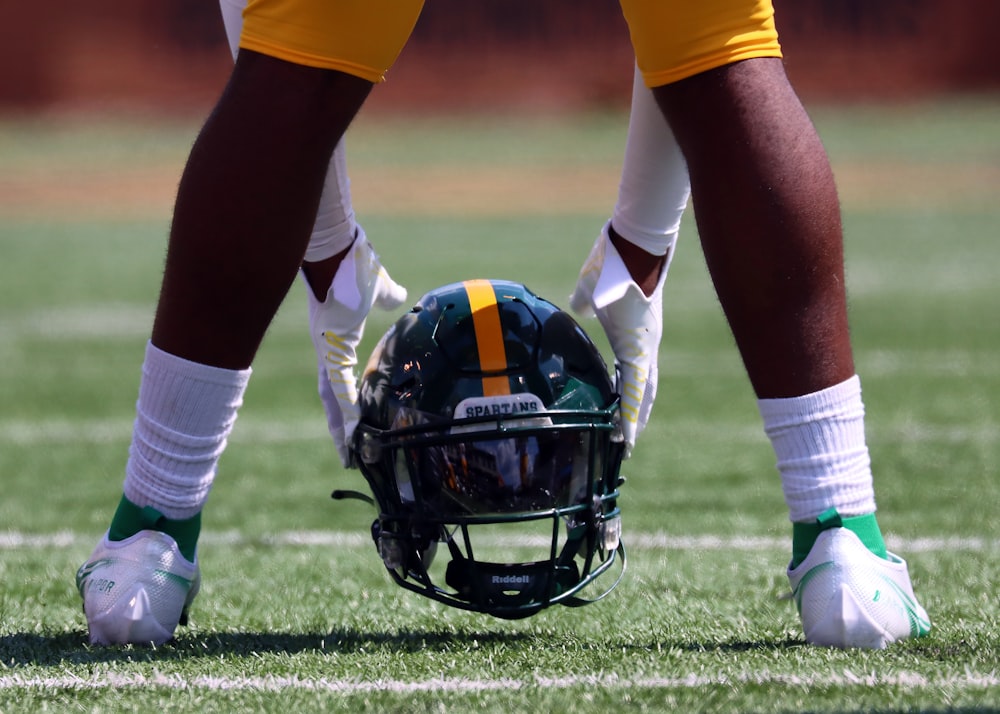 a close up of a football helmet on the field