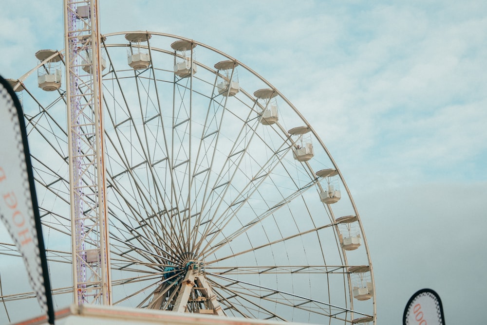 a large ferris wheel sitting next to a ferris wheel