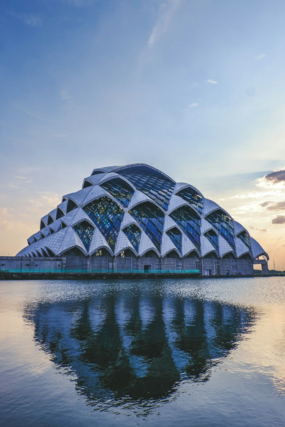 a large building sitting on top of a body of water