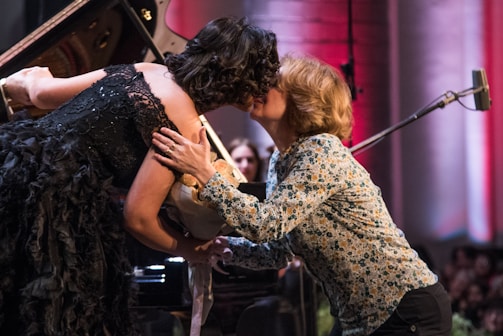 Abby and Nick sharing a playful moment backstage before a performance.