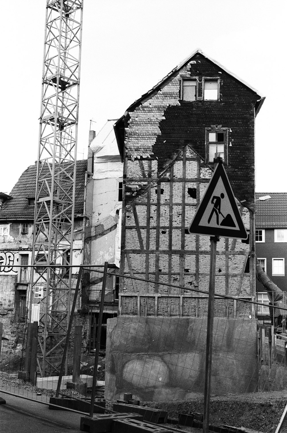 a black and white photo of a building under construction