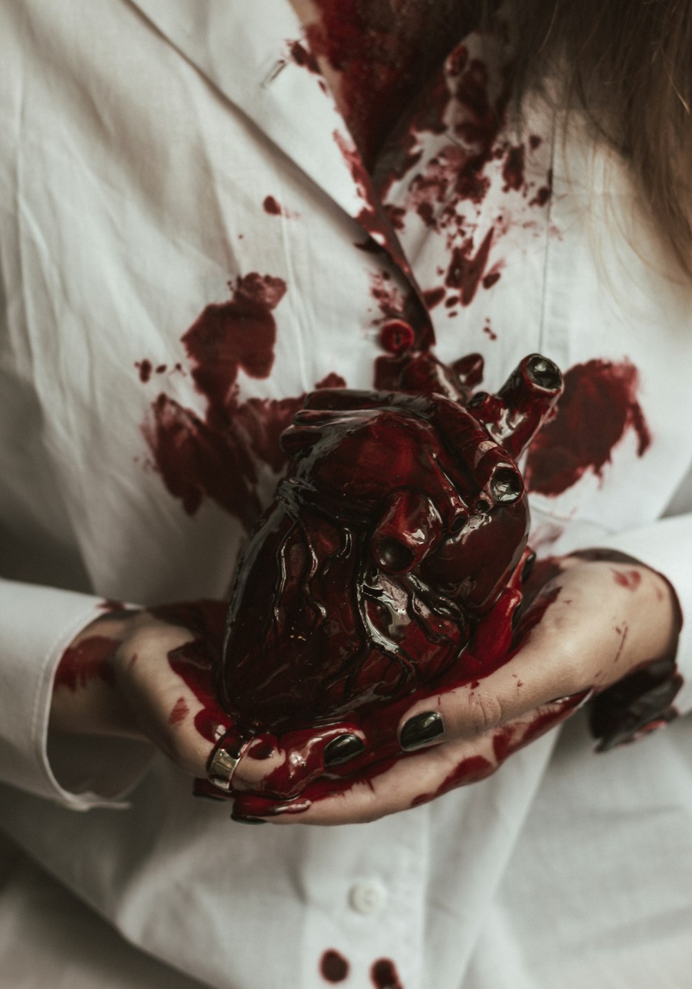 a woman holding a heart in her hands
